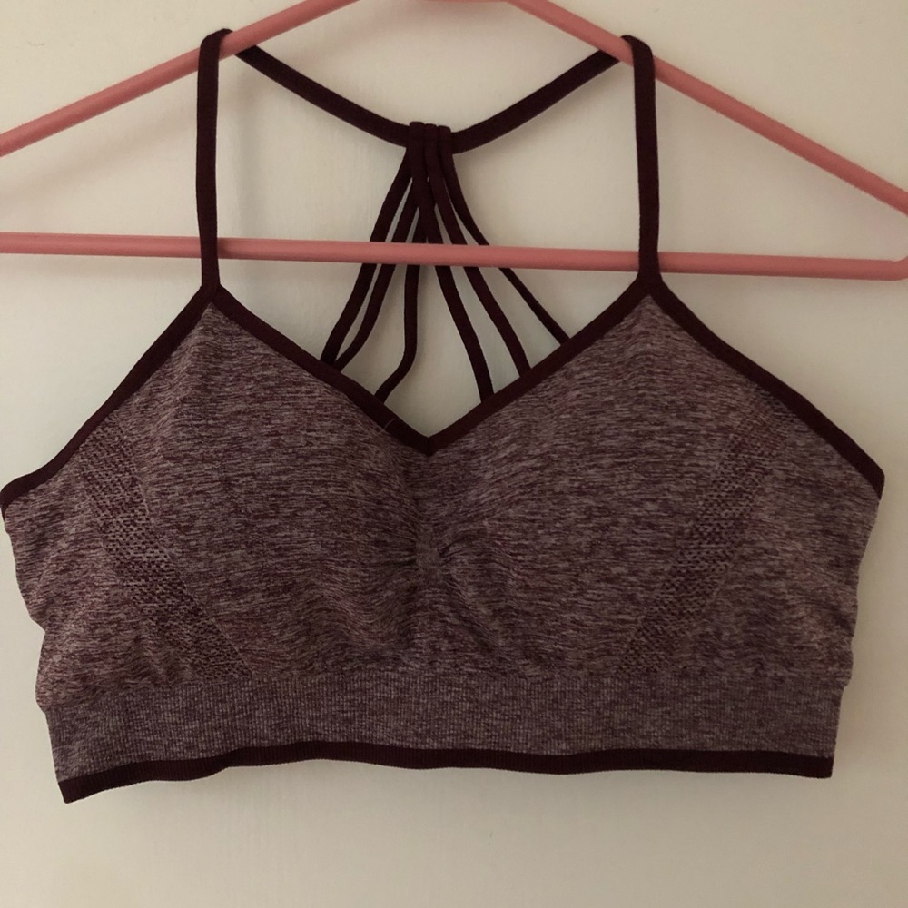 Sports bra with cup pads. Never worn- Tried on, didn’t like.